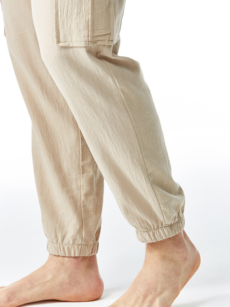 Pantalon décontracté en coton avec poches respirantes de couleur unie pour hommes