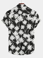 Chemise d'été à manches courtes pour homme avec motif tropical noir style hawaïen de vacances boutonnée