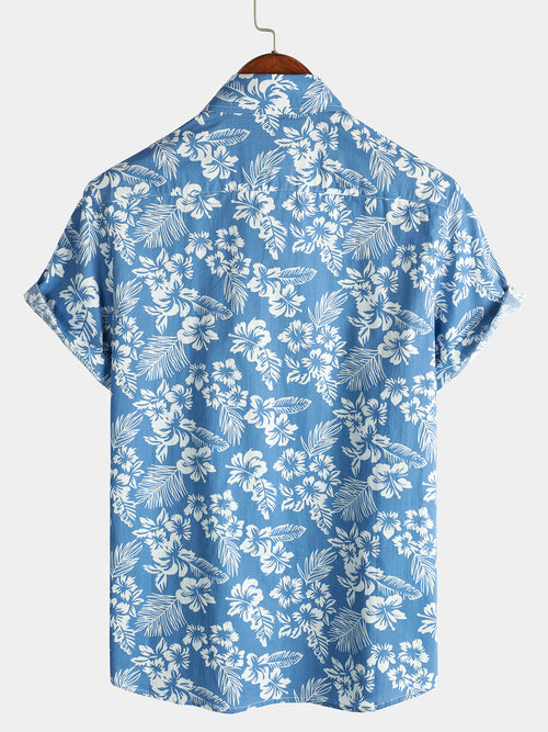 Chemise de plage boutonnée à manches courtes en coton avec feuilles de plantes tropicales bleues pour hommes Aloha Resort